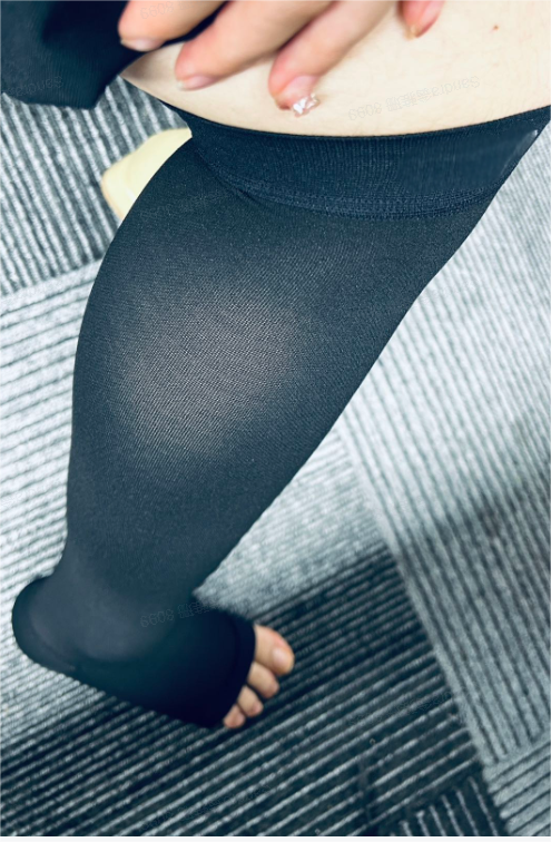 Sheer socks display the needle density on a leg, showing fabric detail.