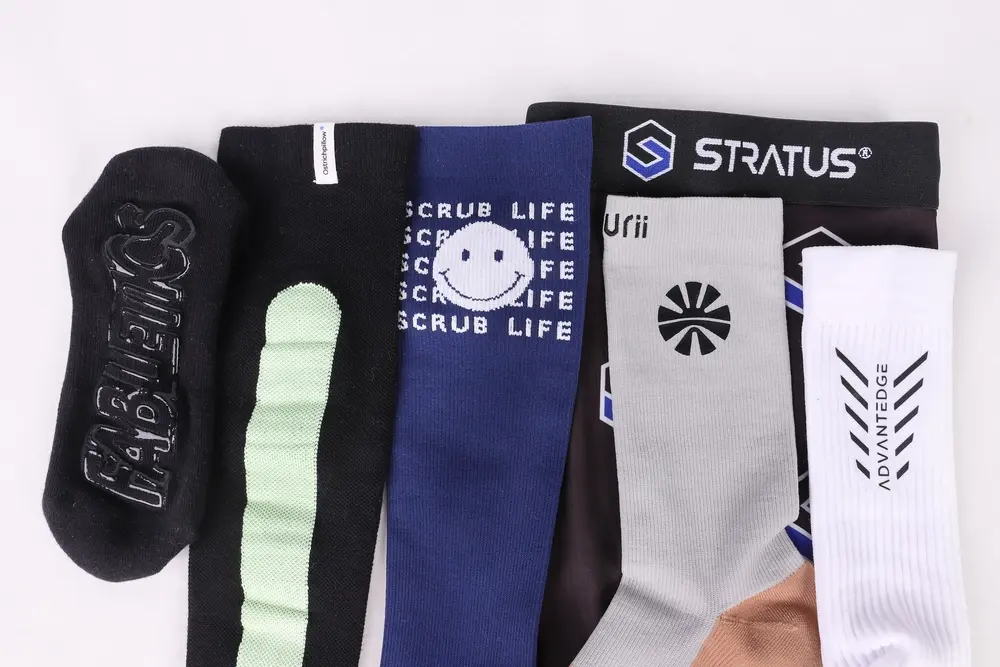 Max hosiery socks logo display featuring various custom designs.