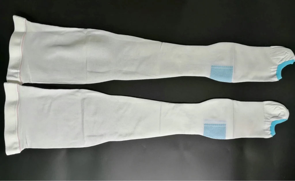 Anti embolism stockings, white and unworn, for medical use.