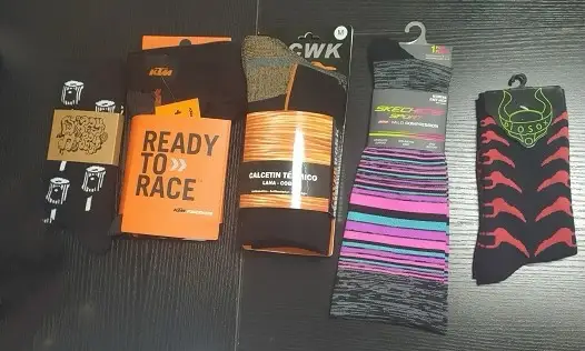 Display of medium socks packaging in different colors and designs.