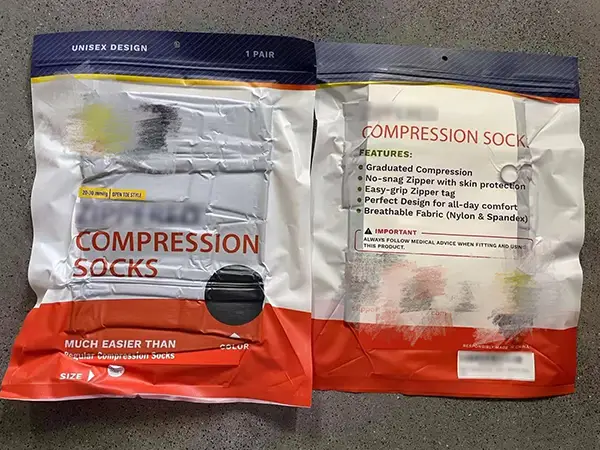 Vacuum sealed packaging for unisex compression socks, one pair.