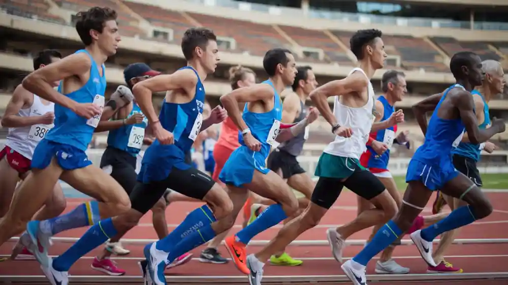 running compression socks worn by marathon runners during a race on a track