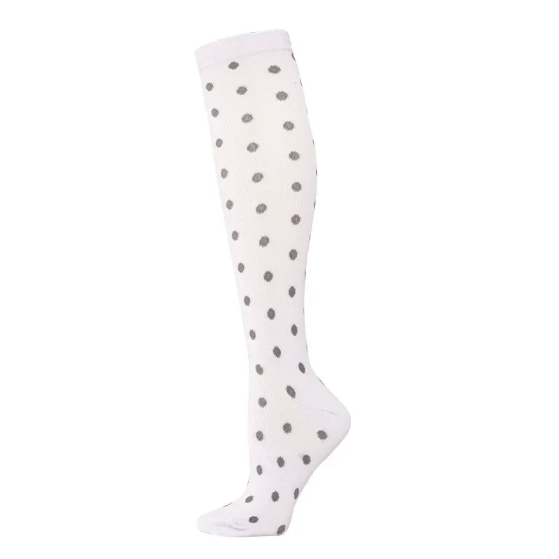 Nursing support socks with polka dot design for comfort and enhanced circulation during long shifts.