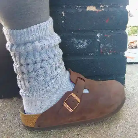 Slouch socks with clogs: a cozy, casual pairing.