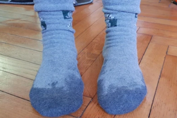 Close up of wet wool socks showing moisture absorption in fibers