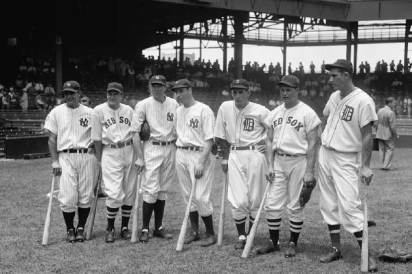 Baseball player wearing traditional high socks as part of a classic uniform”