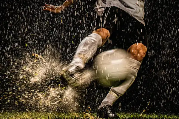 Football with socks on rainy day