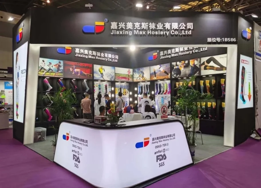 A trade show booth for Max Hosiery, showcasing their diverse range of hosiery products.