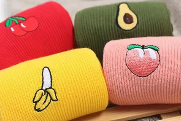 Embroidery logo on different socks such as banana & peach