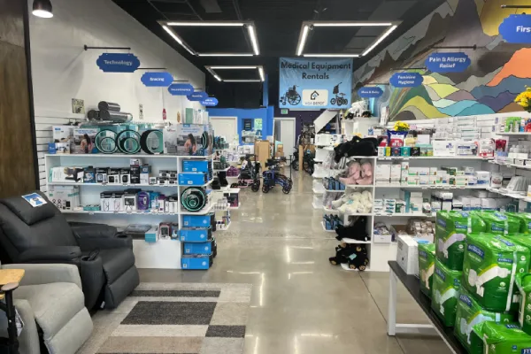 Interior of a medical supply store with shelves of products including compression socks.
