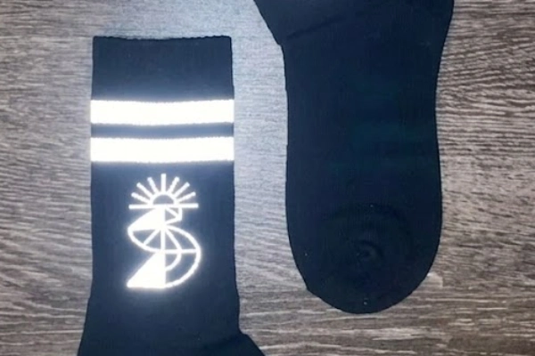 Reflective logo on black socks