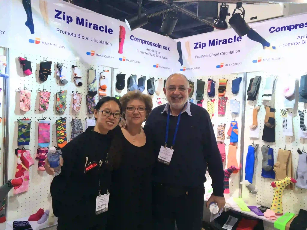 Aries Lin and U.S. client at Las Vegas MAGIC show discussing custom functional socks solutions