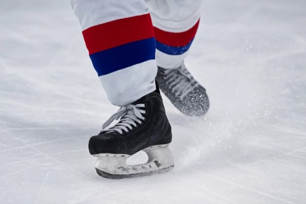 Close up of a durable, reinforced hockey sock with extra padding in high wear areas like the heel and toe
