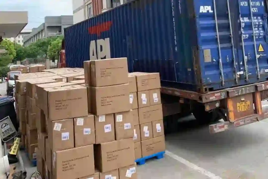 Shipping containers and cardboard boxes ready for logistics transportation and distribution