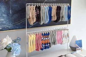 Sourcing grip socks: A display rack showcases various colorful grip socks, ready for selection.
