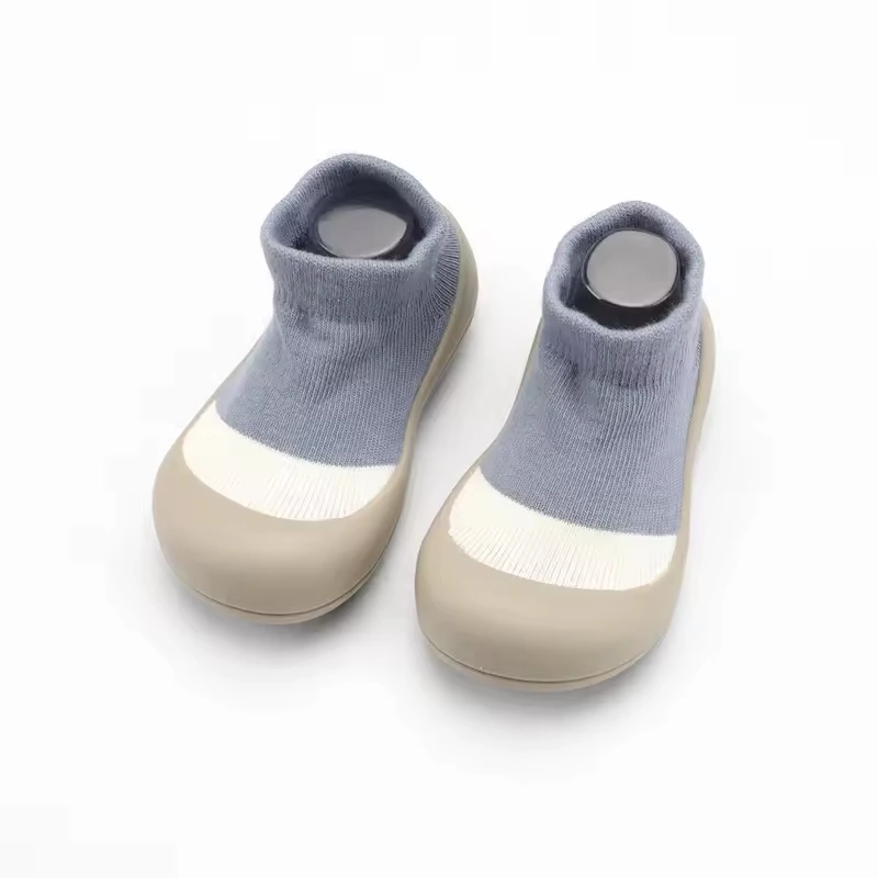 Baby Shoe Socks for toddlers in gray, white, and tan.