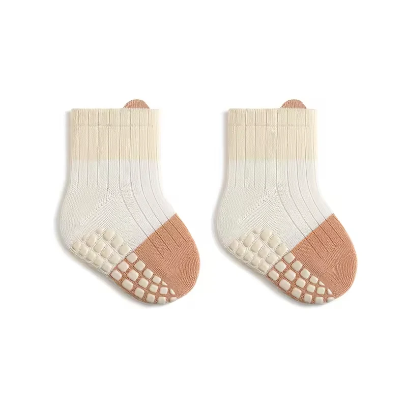 Loose-top Baby Grip Socks with non-slip grips and a two-color design.