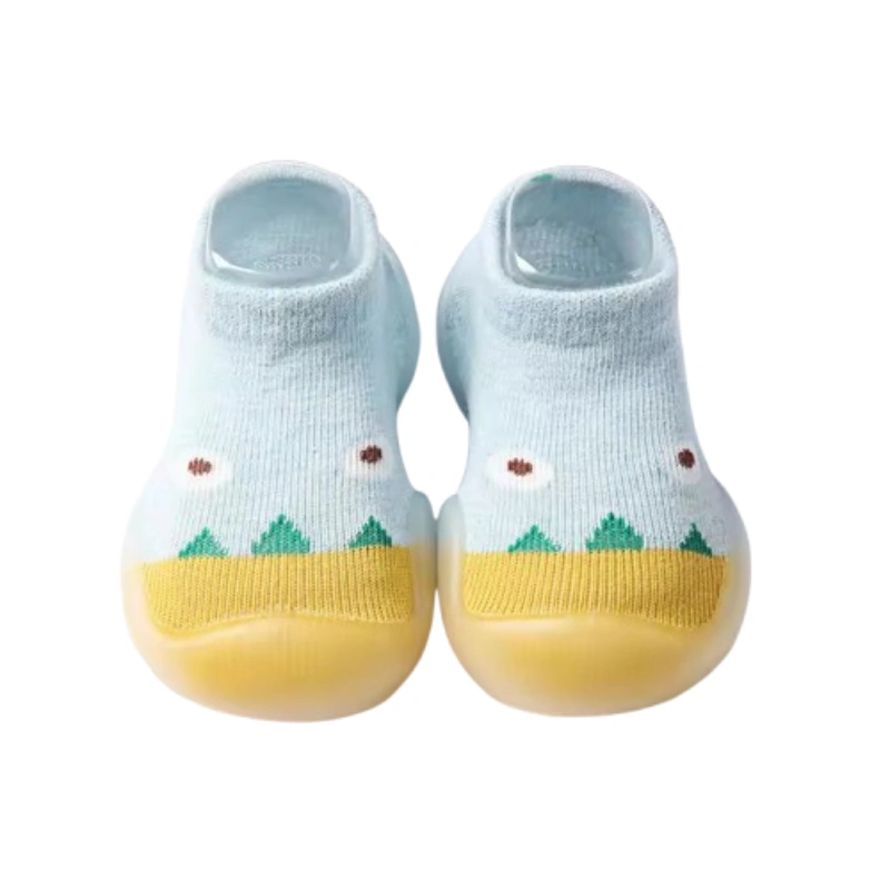 Baby blue rubber sole socks with cute dinosaur and flower designs.