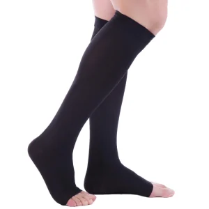 black knee-high compression open toe socks shown on a person's legs