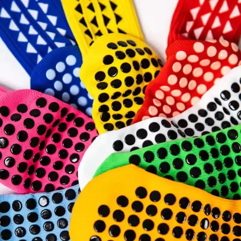 Custom trampoline socks with anti-slip dots in assorted colors.