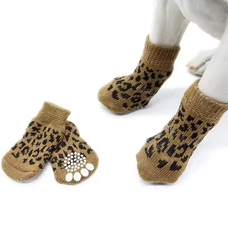 brown leopard print dog socks with grip on a dog's paws.