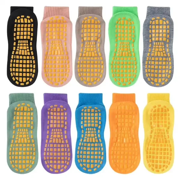 Multicolored trampoline socks with anti-slip rubber grips for kids and adults.