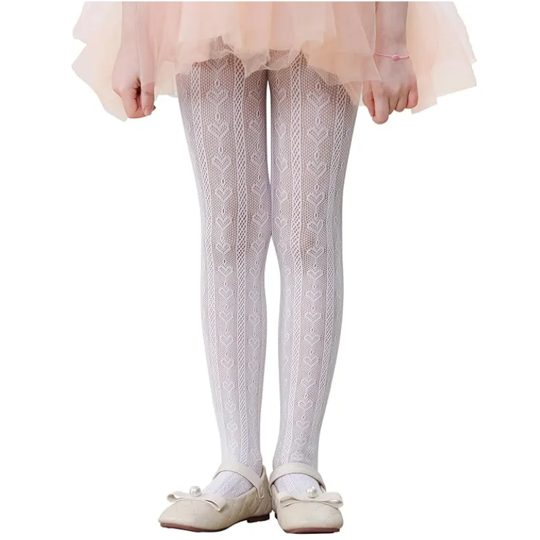 Girl modeling white kids lace tights with a pink tutu dress.