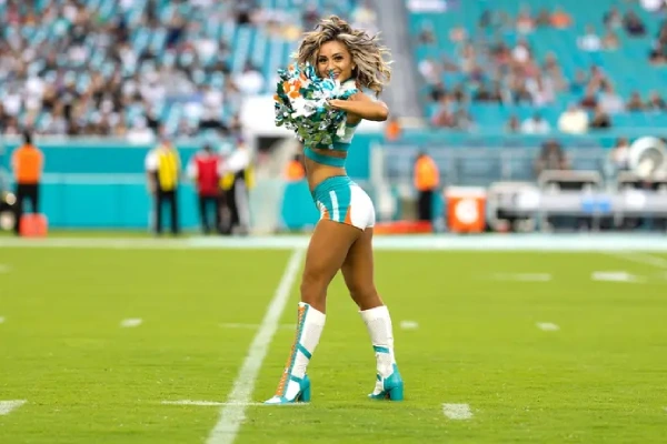 Cheerleaders showing uniform socks as part of a polished game day look