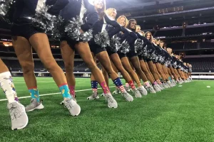 Cheerleading team lined up with matching safe socks that balance safety and style