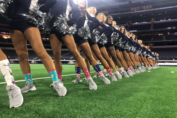 Cheerleading team lined up with matching safe socks that balance safety and style