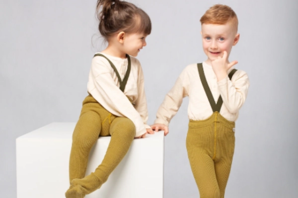 Children wearing gender neutral tights in everyday outfits, showing inclusivity in kidswear trends