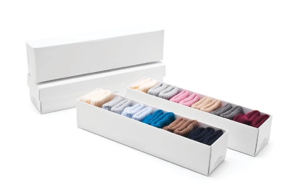 Daycare socks packaged in bulk with labels, showing procurement solutions like custom logos, eco friendly materials, and multipacks