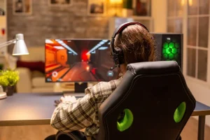 Esports player sitting for long hours, showing potential leg fatigue and health risks from prolonged gaming