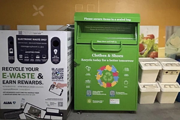Old socks placed in textile recycling bin promoting sustainable disposal