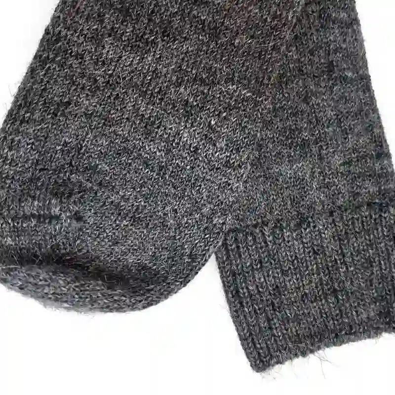 Close-up of the intricate knit and texture of alpaca hiking socks, showcasing product details