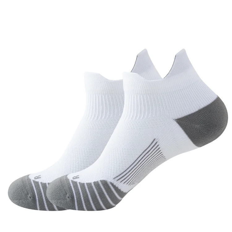 No show arch compression running Socks: White low-cut running socks with grey heel and toe cushioning, striped design.