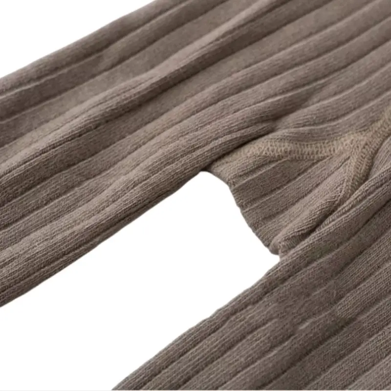 Brown ribbed kids' tights showcasing the industrial-grade stitching standards