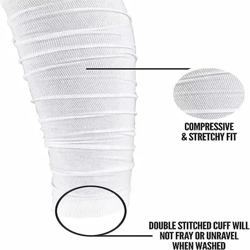 A close-up of a white football leg sleeve shows its compressive and stretchy material.