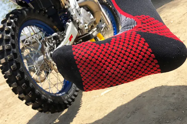 Motocross riders wearing off road socks and boots on race day and trail rides