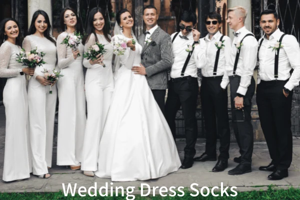 Groomsmen in formal wear and Wedding dress socks posing with the bridal party