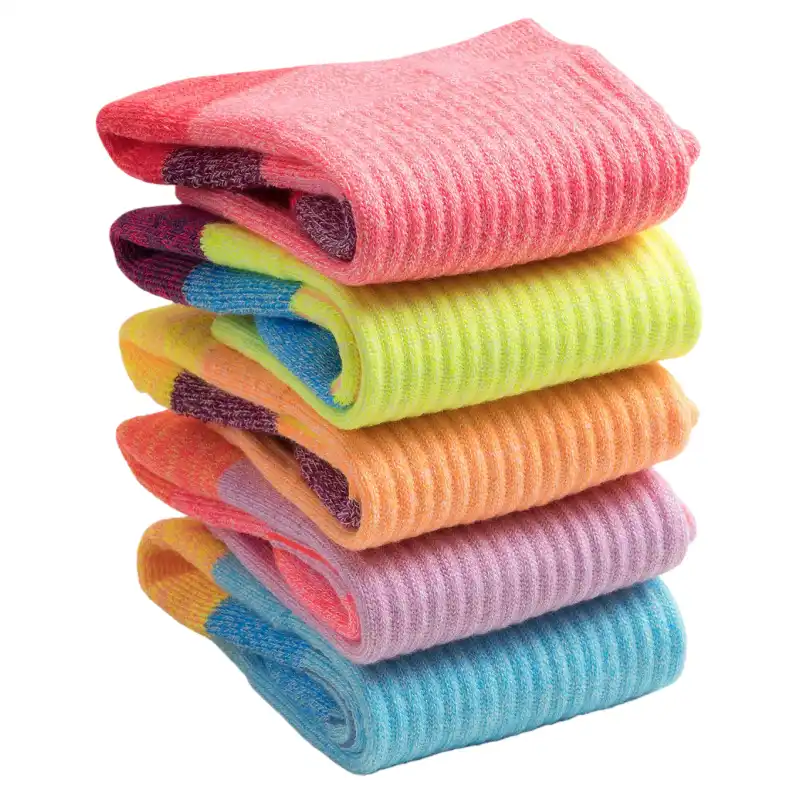 Stack of five brightly colorful cycling socks with ribbed cuffs in pink, yellow, orange, purple, and blue