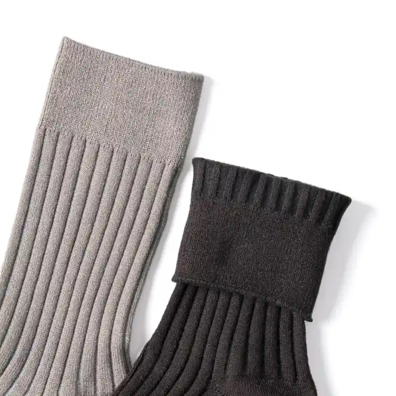 Detailed view of the ribbed cuff on grey and dark double layer hiking socks
