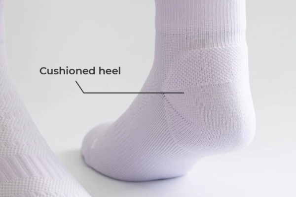 Marathon running socks with targeted cushioning in heel, toe, and sole for reduced impact and improved comfort
