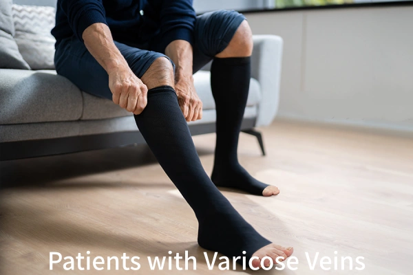 Man sitting on couch pulling up black Toeless compression socks for varicose veins relief