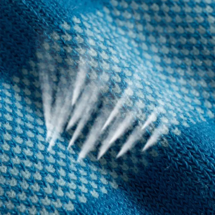 close-up of moisture-wicking running sock fabric made from polyester and merino blend to keep feet dry and blister-free