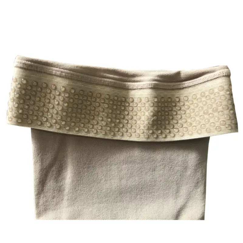 close-up of the anti-slip silicone band on the beige thigh high compression socks open toe