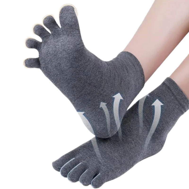 A person wearing breathable grey wool toe socks, flexing one foot to show the five-toe design