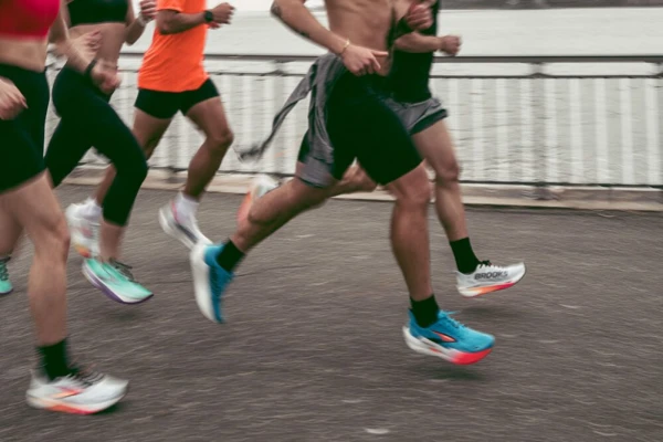 Runners wearing supportive socks while training outdoors for active lifestyles