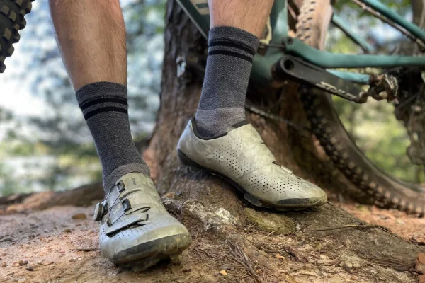 Close up of colorful cycling socks displayed in a bike shop, symbolising a growing, repeat purchase category in the cycling market