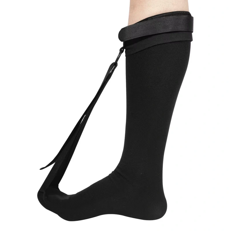 Black plantar fasciitis night socks with adjustable strap for overnight foot stretch
